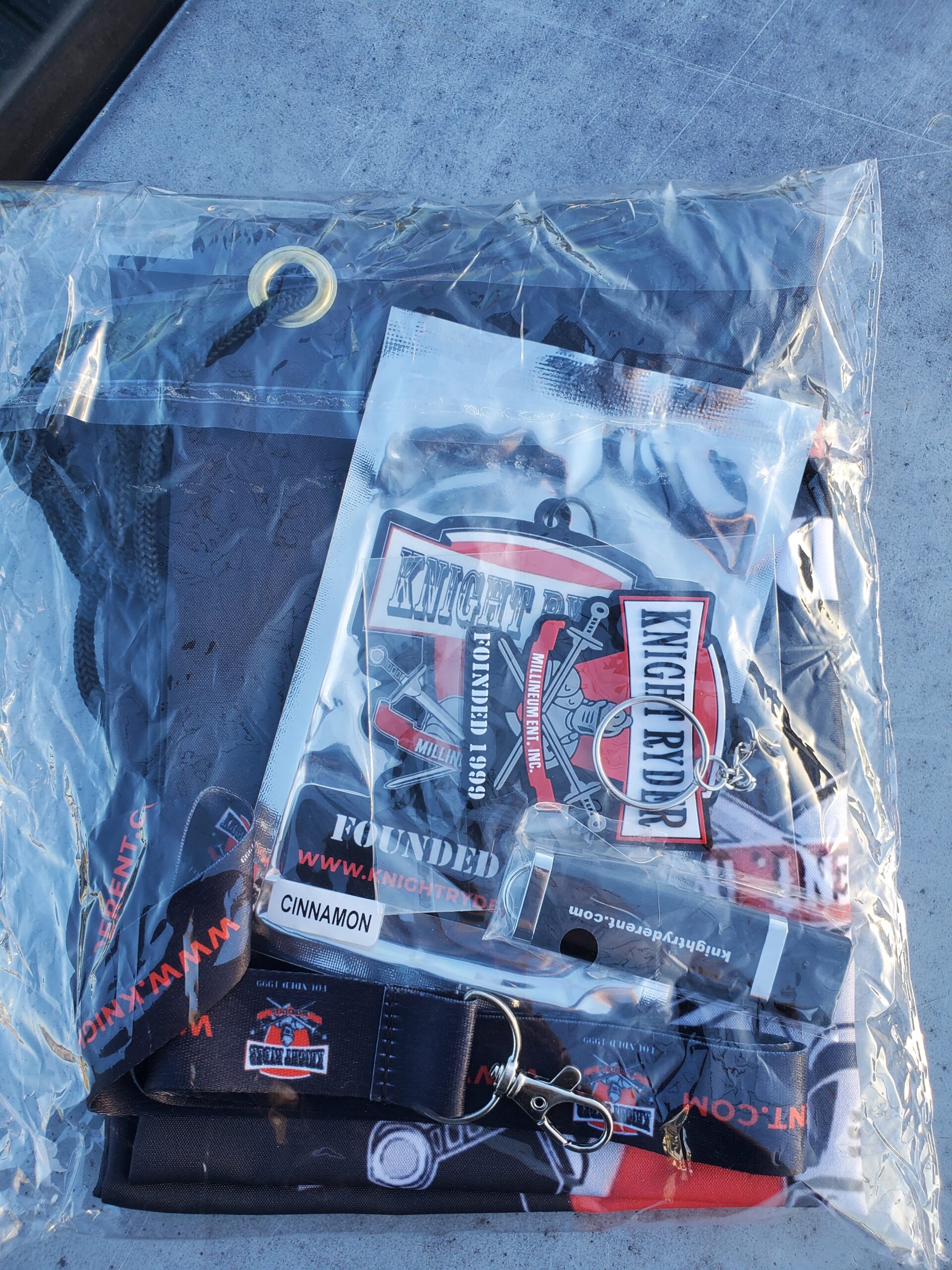 A bag of cigarettes and other items on the ground.