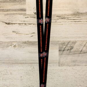 A pair of black and orange lanyards on top of a wooden table.
